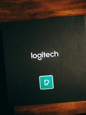 Black Logitech Box on Brown Wooden Table