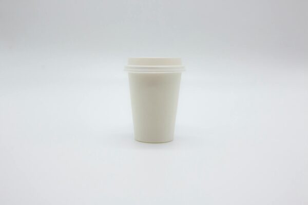 Paper Cup with Lid on White Surface