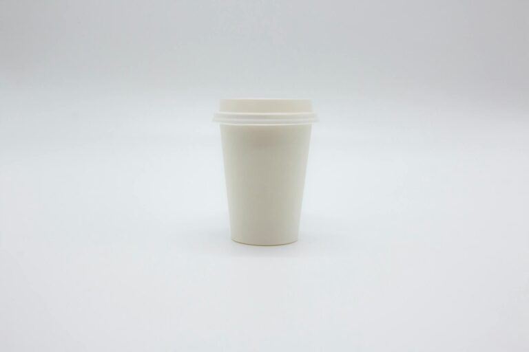 Paper Cup with Lid on White Surface